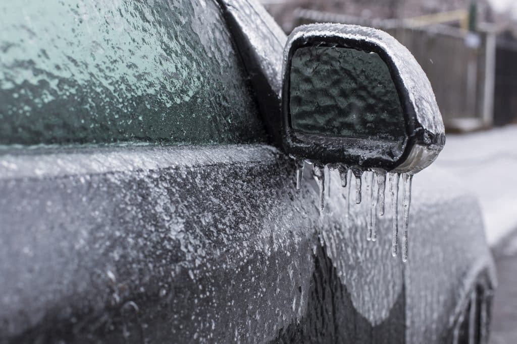 how to protect car clear coat in winter picture of car covered in ice